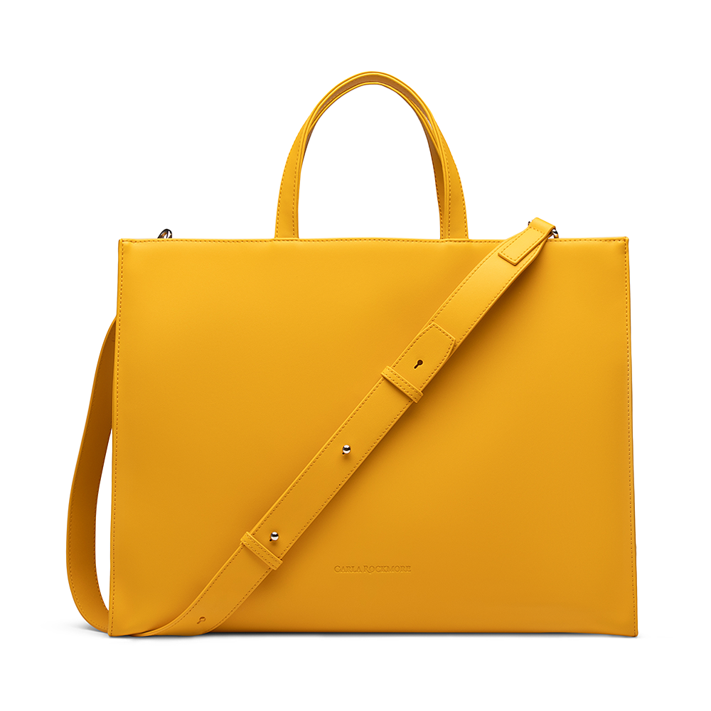 Tote Bag in saffron with the detachable shoulder strap on a white background.