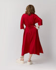 Close-up of the back of the poppy shirt dress featuring a neatly tied bow at the waist.