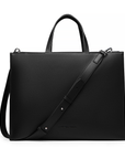 2-in-1 Tote Bag in Black with adjustable strap on a white background.