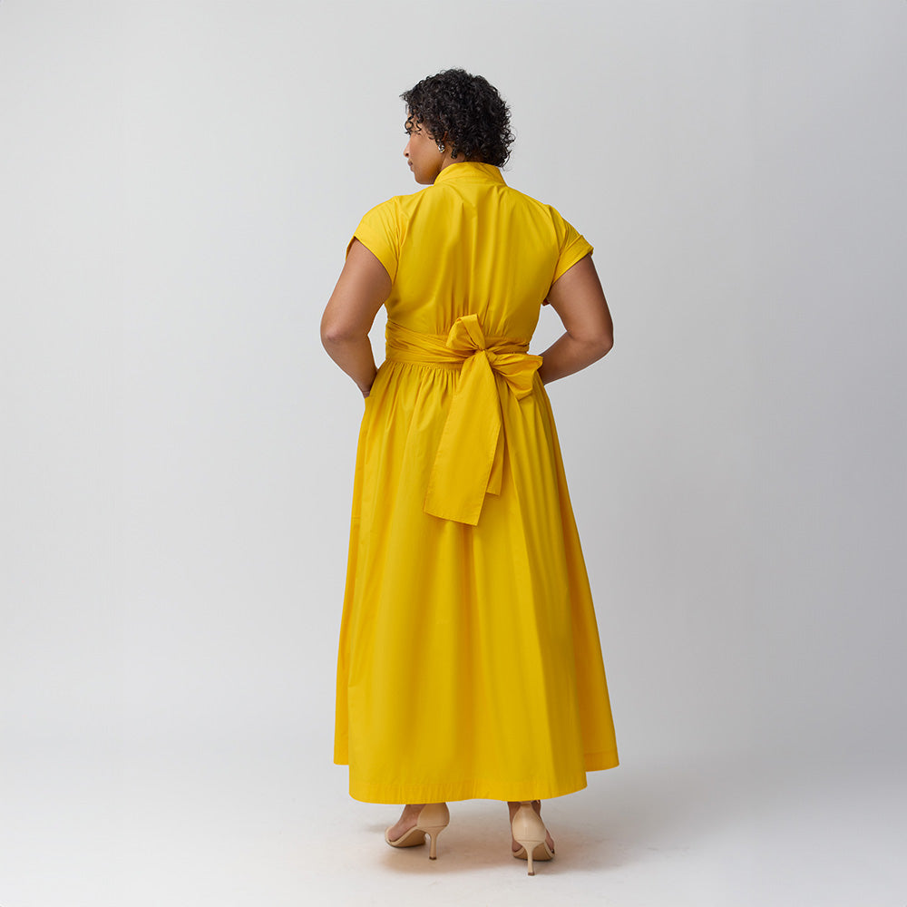 A model with the Marigold wrap dress showing the back of the dress.