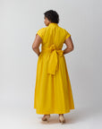 A model with the Marigold wrap dress showing the back of the dress.