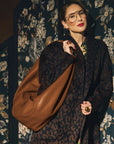 Carla modeling the Sling Bag in Saddle.