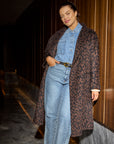Model wearing the Leopard Jacquard coat with jeans shirt and pants.