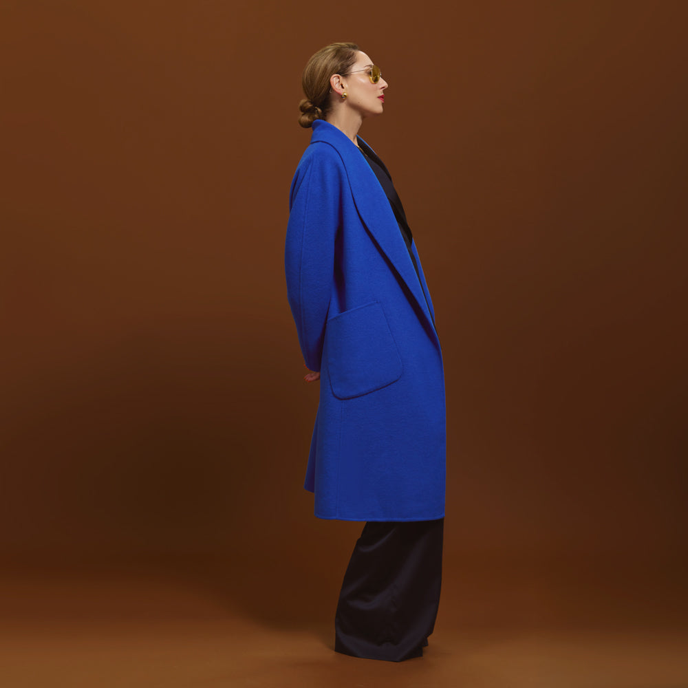 Close-up of Carla wearing the Indispensable Car Coat Wool Blend in Cobalt.