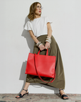 Carla Rockmore modeling the 2-in-1 Tote Bag in chili.