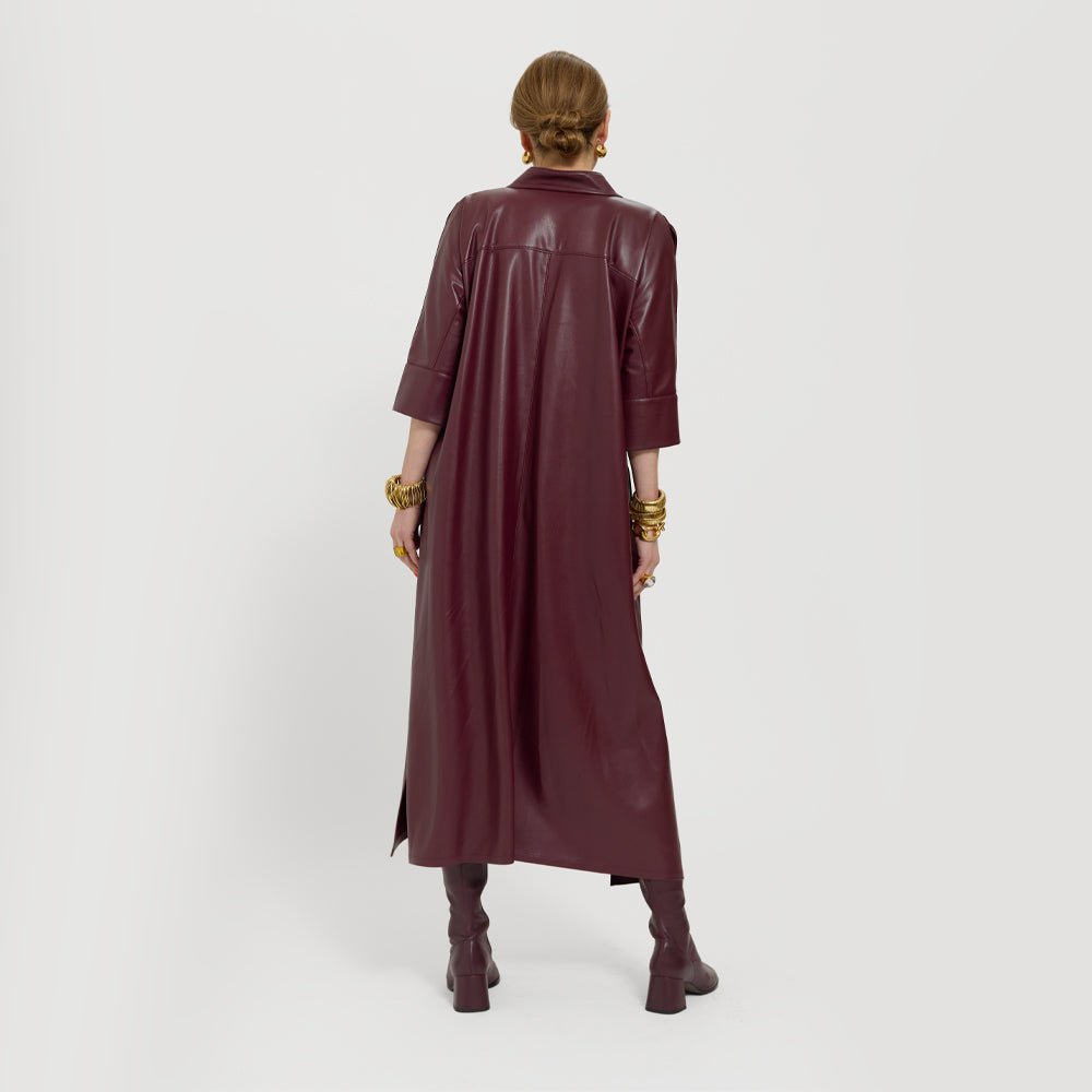 Carla modeling the Merlot dress. She is showing the back not tied.