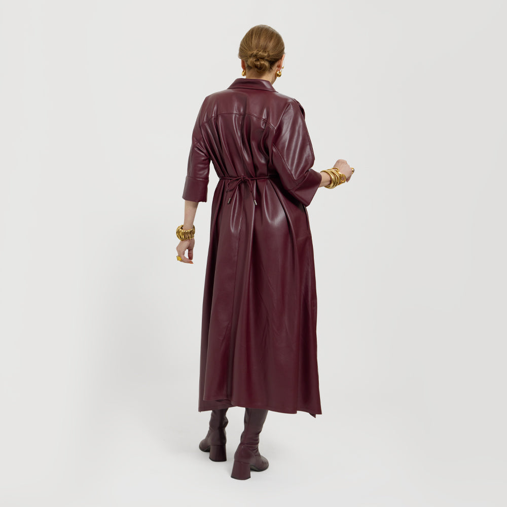 Carla modeling the Merlot dress. She is showing it tied on the back.