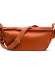 Mini Sling Bag in Burnt Sienna with a strap on a white background