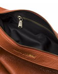 Mini Sling Bag in Burnt Sienna with inside pocket zipper on a white background.
