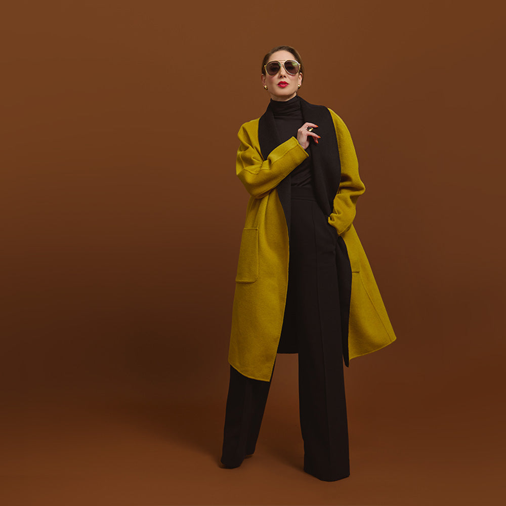 Carla modeling the Reversible Indispensable Car Coat Wool Blend. The coats comes in Black and Moss.