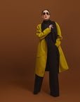 Carla modeling the Reversible Indispensable Car Coat Wool Blend. The coats comes in Black and Moss.