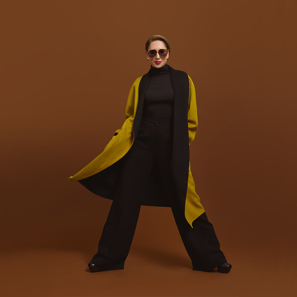 Carla modeling the coat in Moss, but you see the inside of the coat in black.