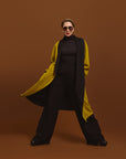 Carla modeling the coat in Moss, but you see the inside of the coat in black.