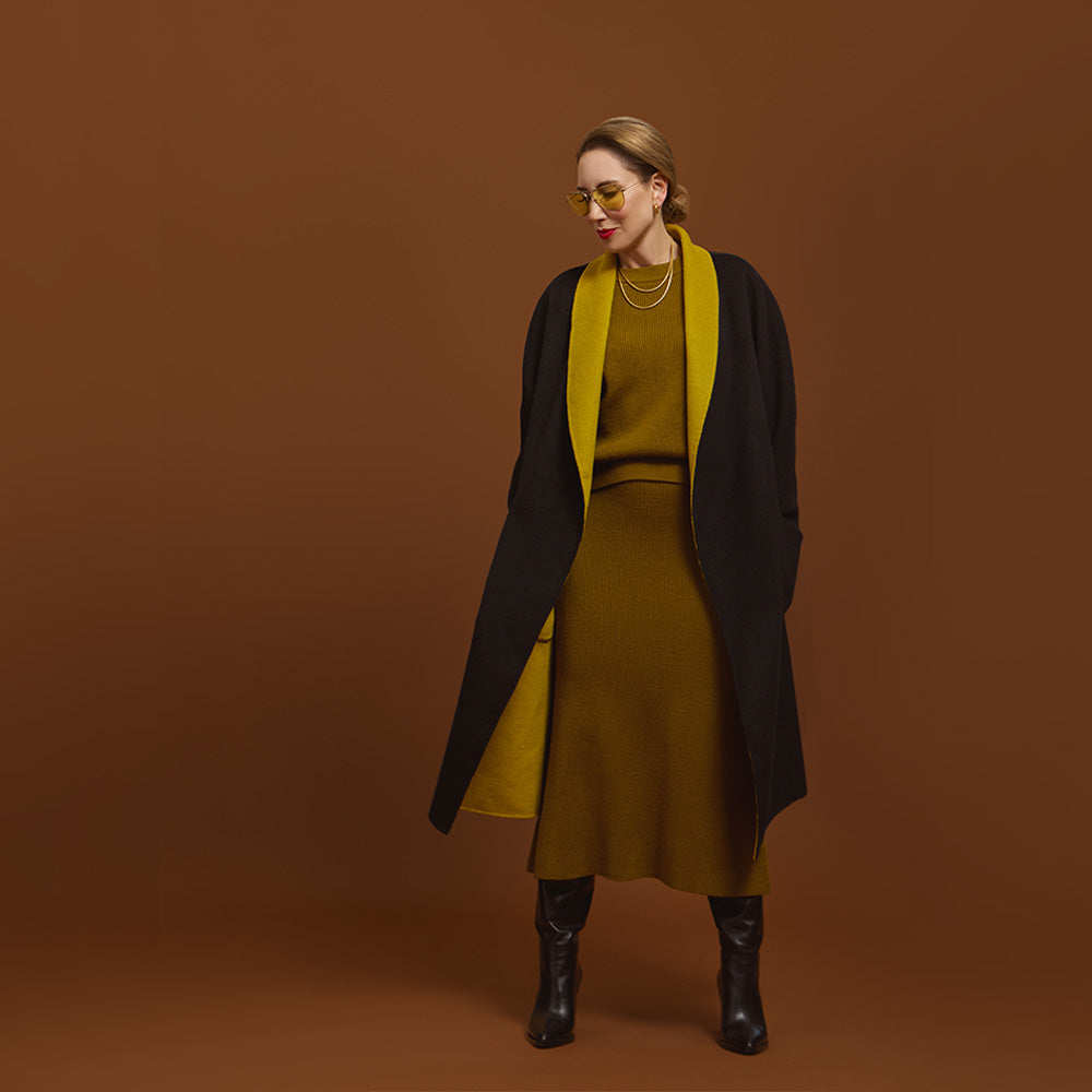 Carla modeling the Reversible Indispensable Car Coat Wool Blend in Black and Moss.