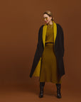 Carla modeling the Reversible Indispensable Car Coat Wool Blend in Black and Moss.