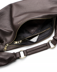 Sling Bag in Chocolate with a zipper on a white background.