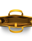 Saffron tote inside contains: laptop pocket, zipper pockets for small items, twin open interior pockets to slide in your phone and other items. it has a holder for your water bottle.