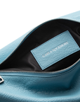 Close up of the Sling Bag 2.0 in Sky Blue
Bag showing details of the vegan leather texture. Also, the inside of the bag which is black.