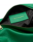 Close-up of the Sling Bag in Emerald Greenwith a visible brand label on a white background.