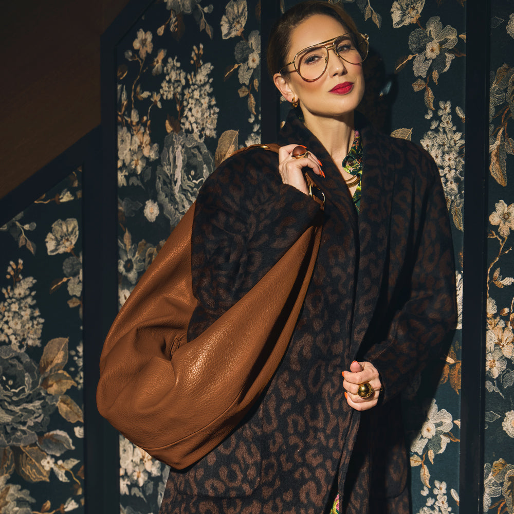 Carla modeling the Sling Bag in Saddle. 