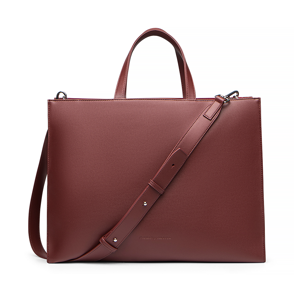 2-in-1 Tote Bag in Cherry Cola bag with an adjsutable shoulder strap on a white background.