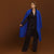 Carla wearing the Indispensable Car Coat Wool Blend in Cobalt in a black jacket and pants.