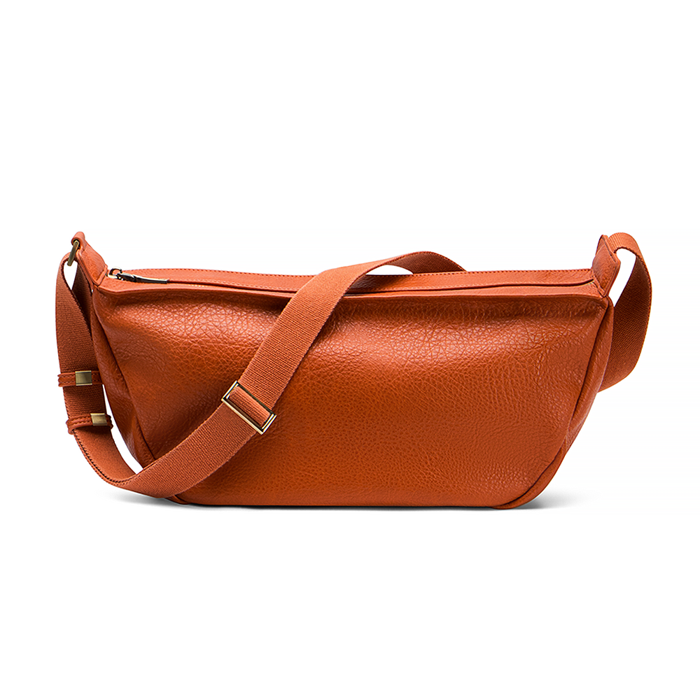 Mini Sling Bag in Burnt Sienna with a strap on a white background