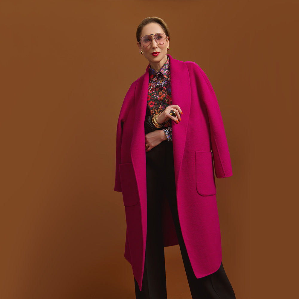 Carla in the Indispensable Car Coat Wool Blend in Orchid against a brown background.