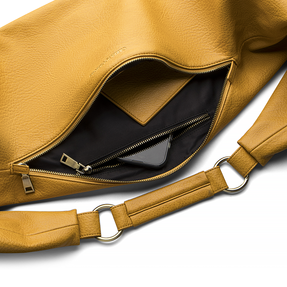 Sling Bag 3.0 in Honeycomb showing the inside pocket zipper.